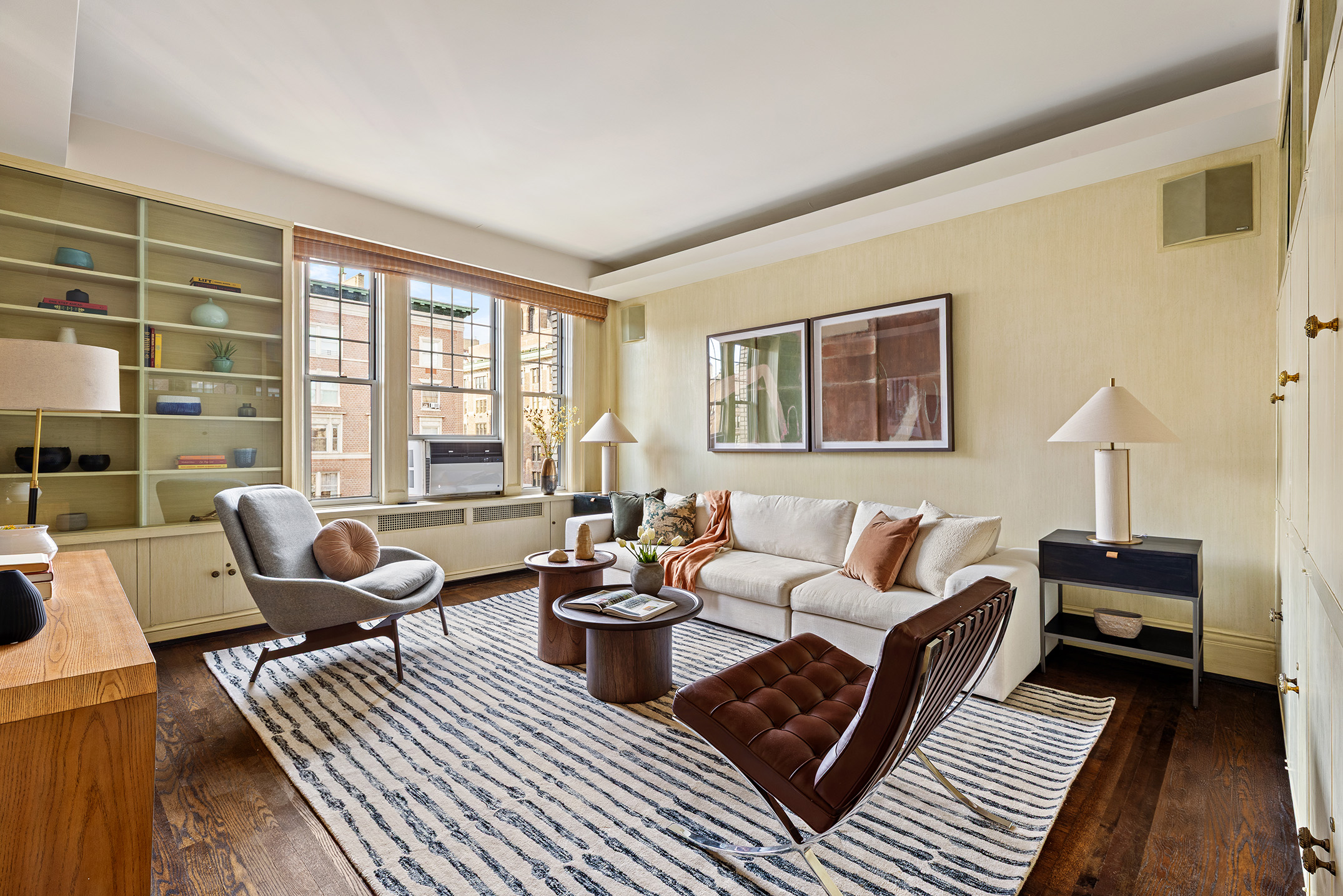 875 Park Avenue, Unit 11C Manhattan, NY 10075 - Photo 8 of 25 a living room with furniture and a large window