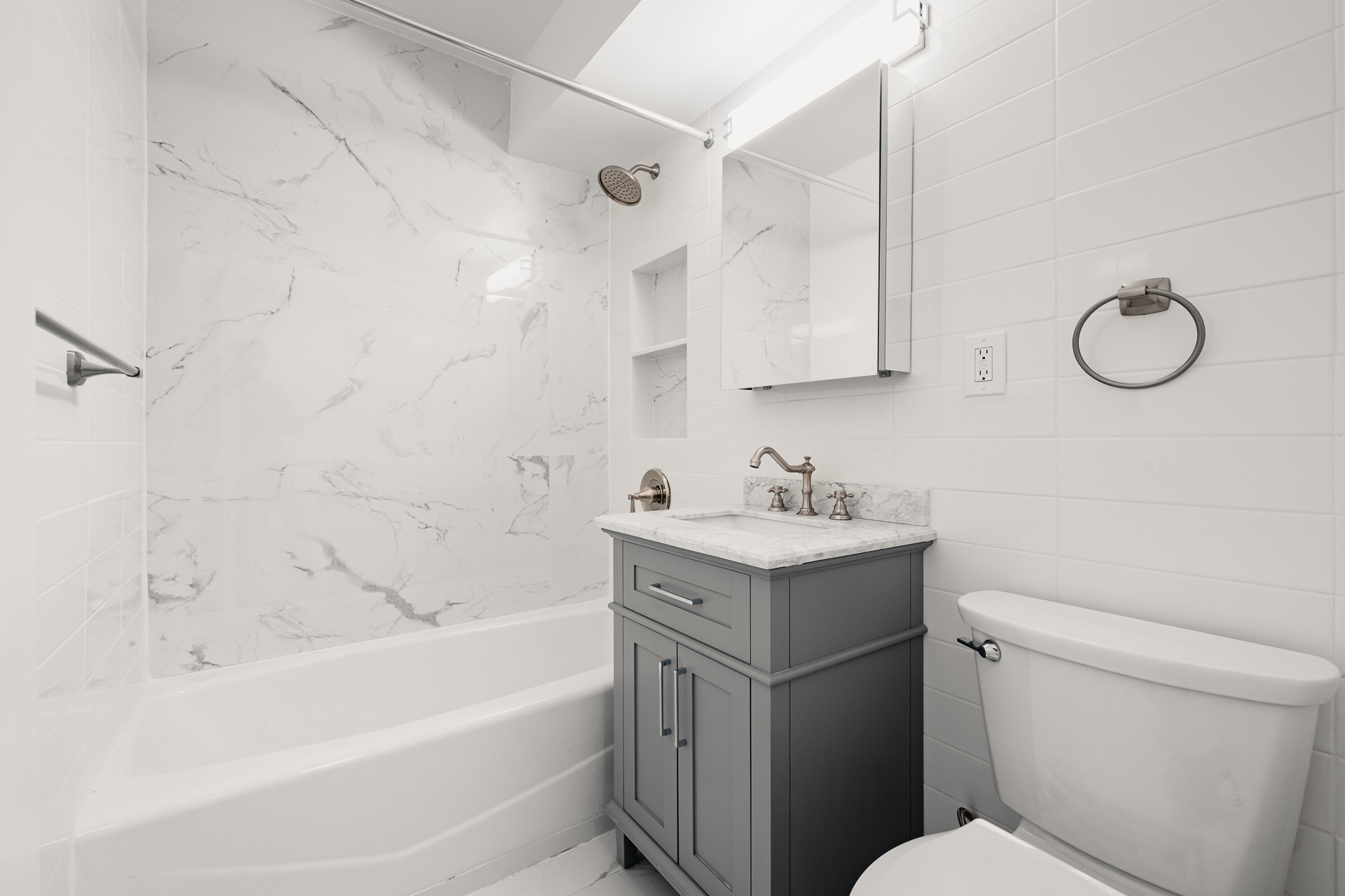 122 Ashland Place, Unit 15F Brooklyn, NY 11201 - Photo 5 of 13 a bathroom with a sink toilet vanity and bathtub