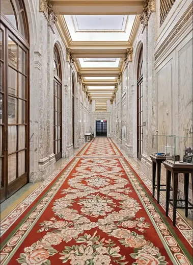 a lobby with furniture and wooden floor
