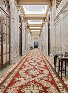 a lobby with furniture and wooden floor