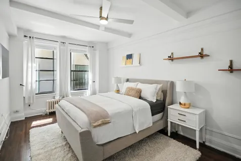 a bed room with a bed and a window