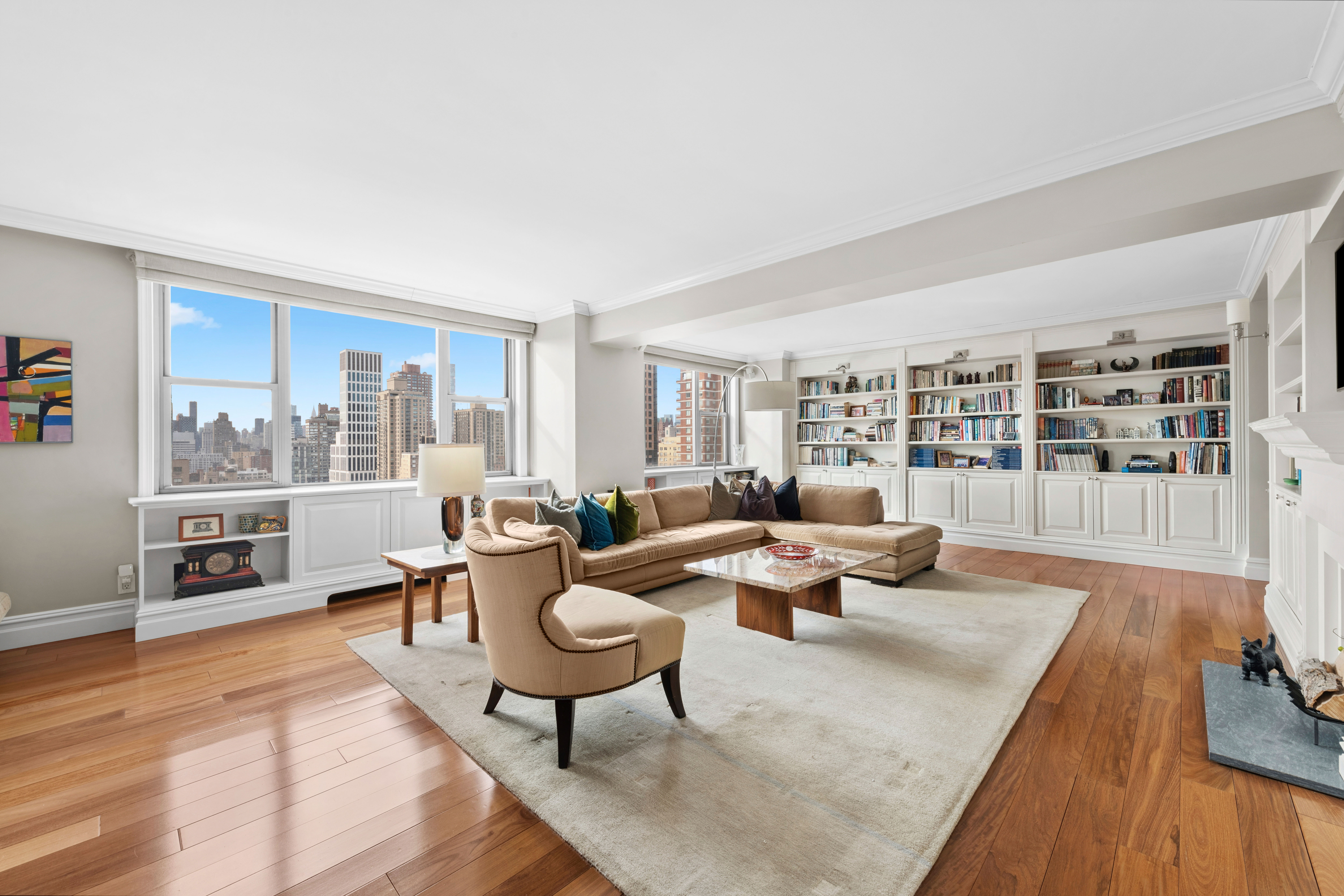 444 East 86th Street, Unit 25EF Manhattan, NY 10028 - Photo 1 of 18 a living room with furniture large window and wooden floor