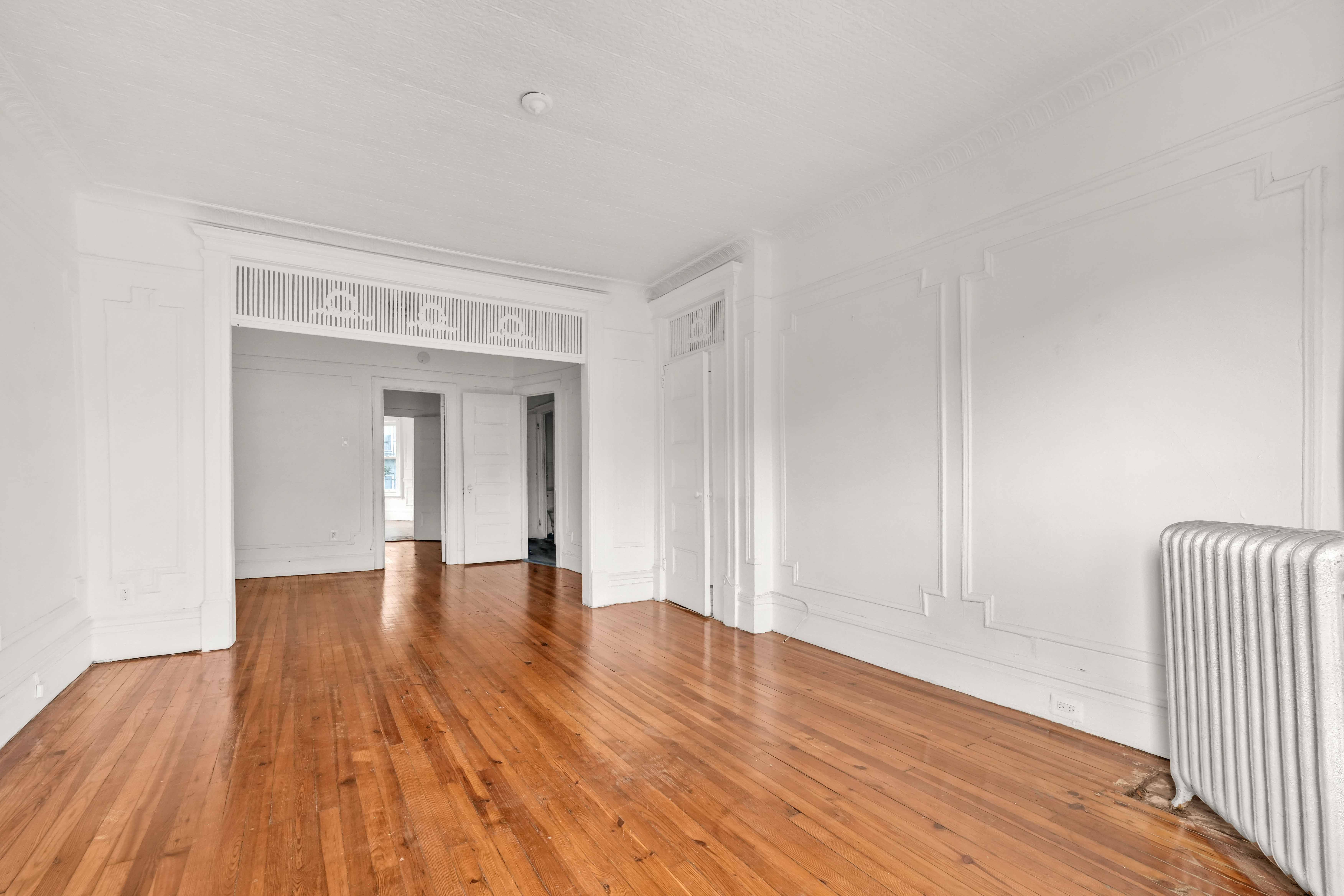278 Lefferts Avenue Brooklyn, NY 11225 - Photo 7 of 56 a view of an empty room and wooden floor