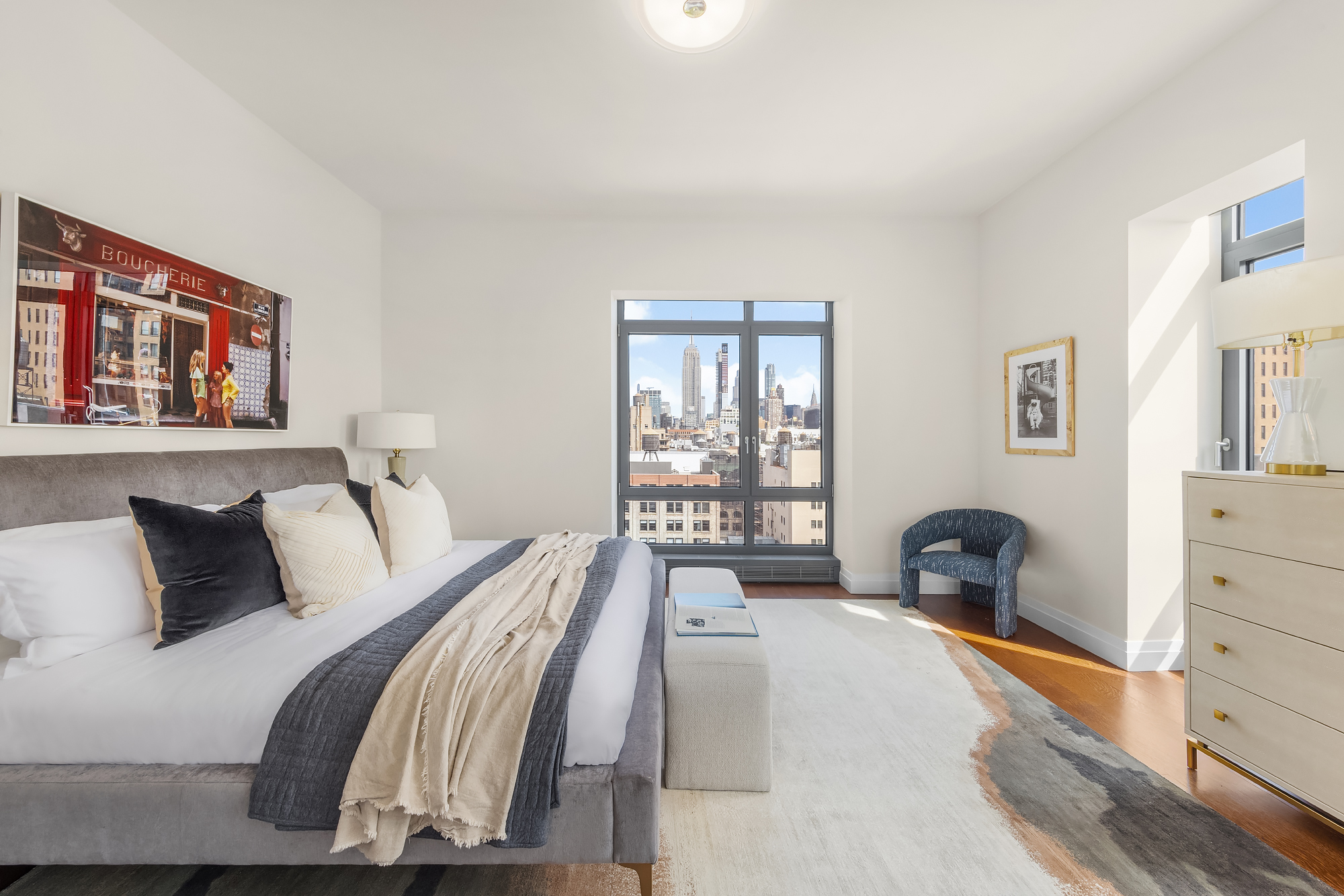 35 West 15th Street, Unit 15D Manhattan, NY 10011 - Photo 8 of 15 a bedroom with a bed and a large window