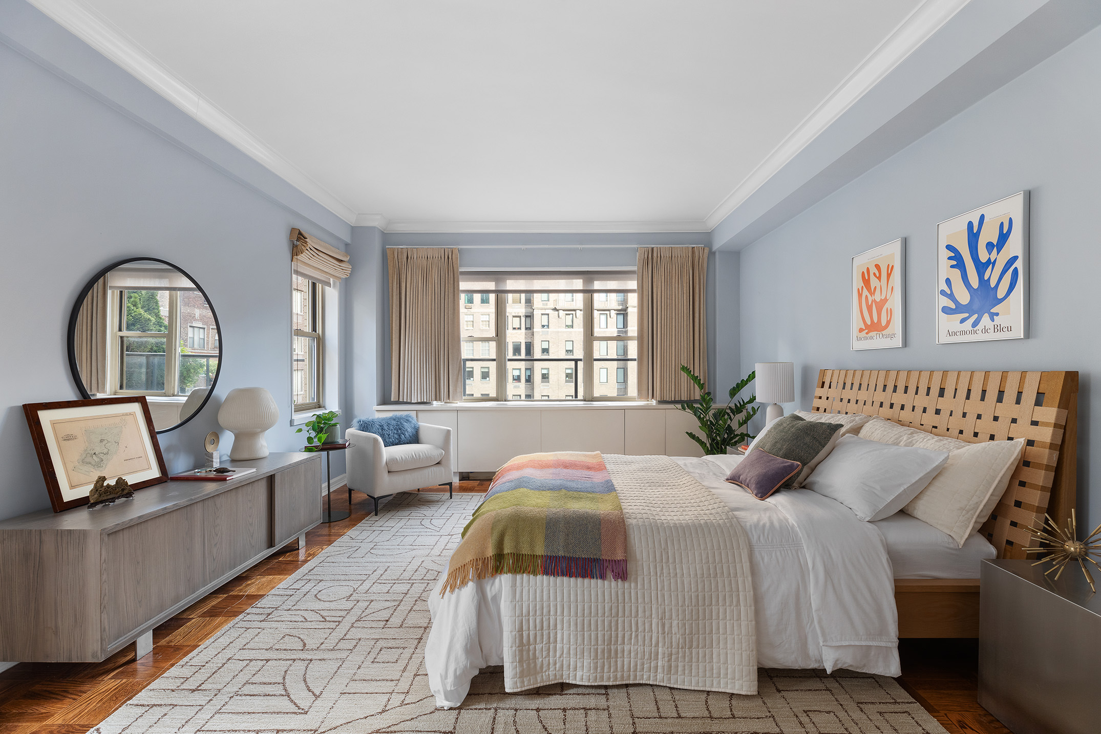 415 East 52nd Street, Unit 12CB Manhattan, NY 10022 - Photo 8 of 12 a bedroom with bed and a large window