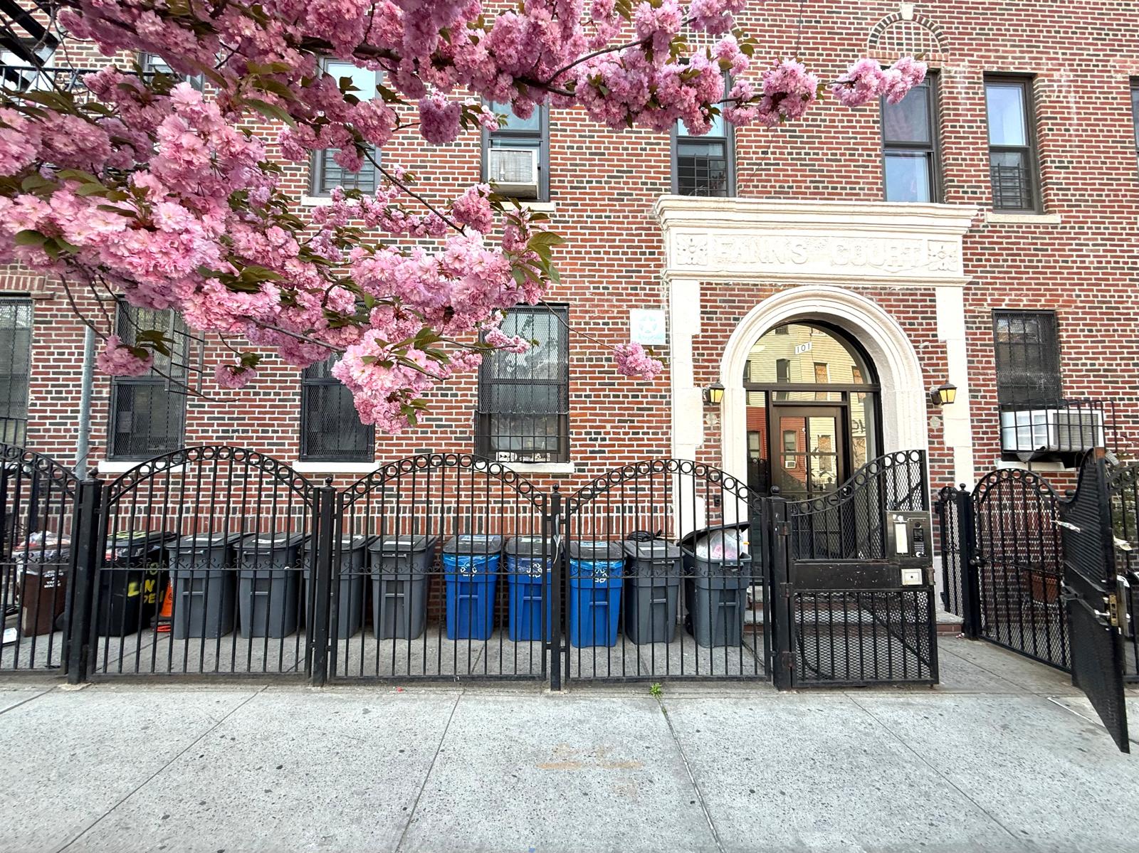 101 Linden Street, Unit 2D Brooklyn, NY 11221 - Photo 8 of 9 a view of a brick house with a iron gate