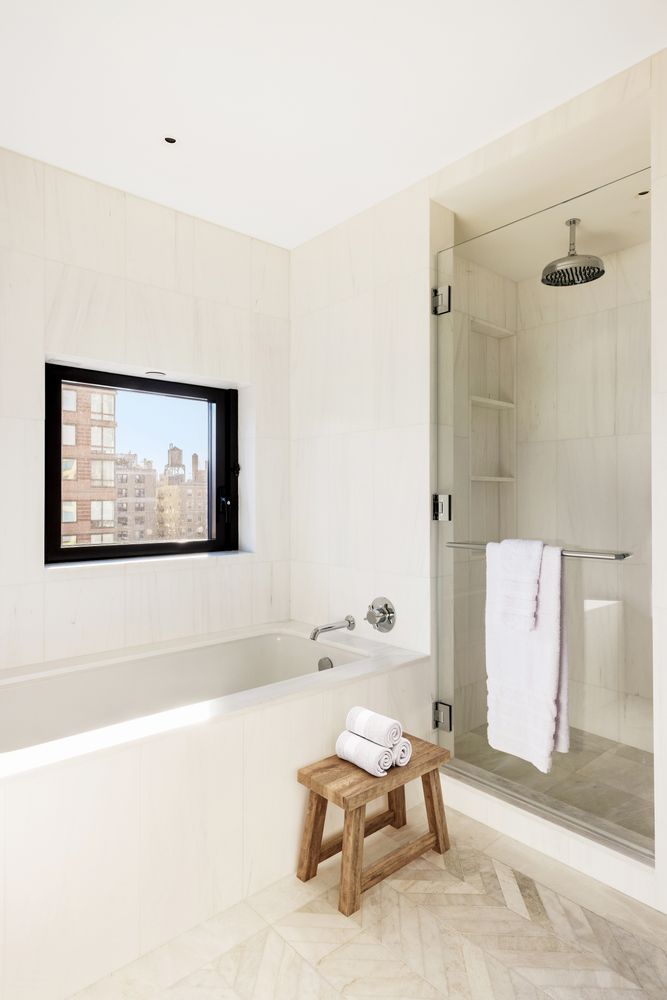 a living room with a couch and a painting on the wall