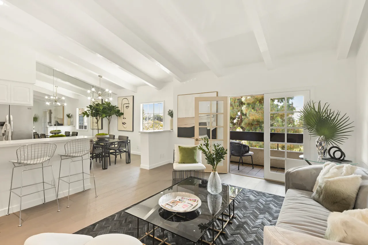 a living room with furniture and a table