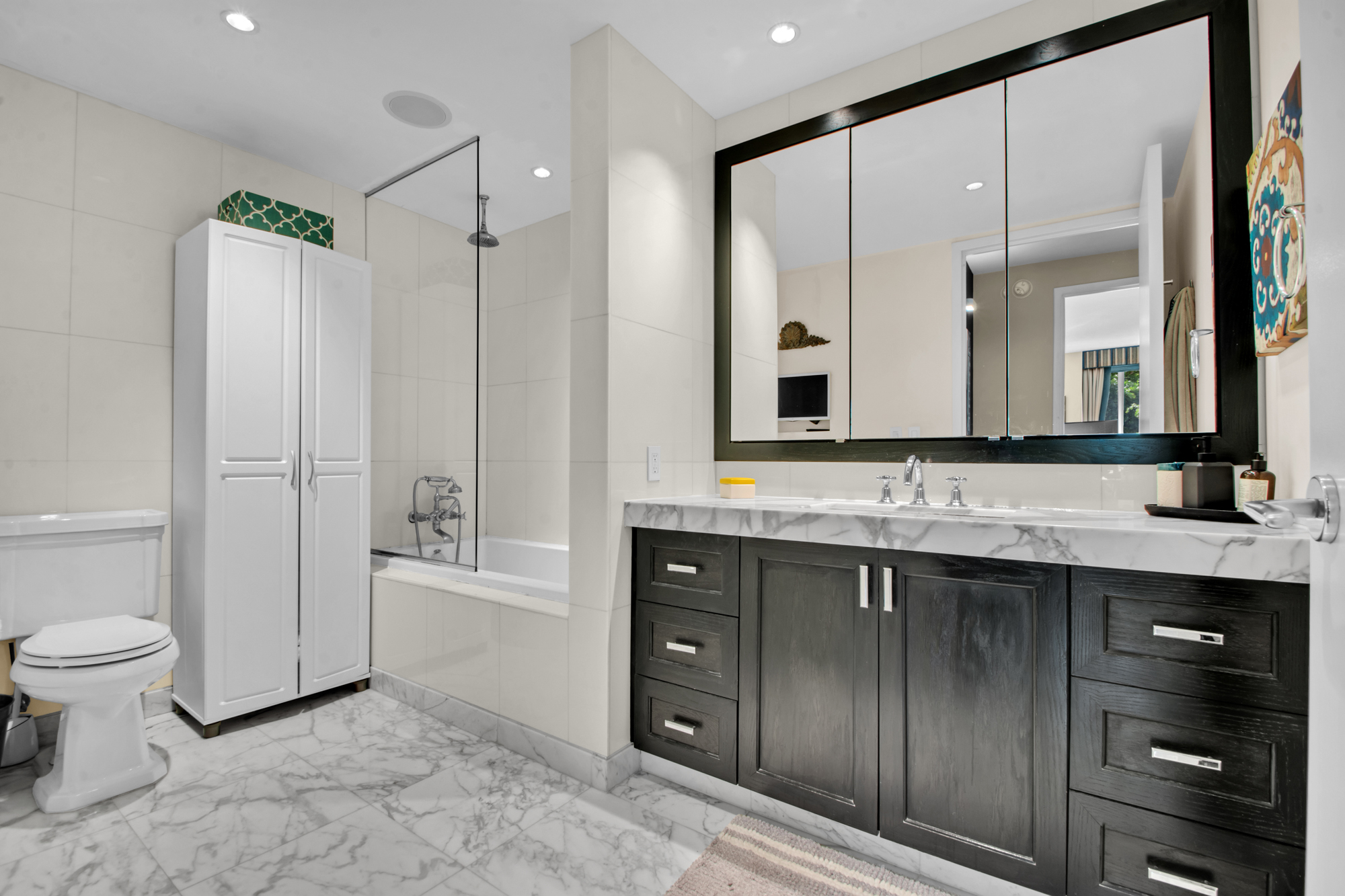 333 Rector Place, Unit 408 Manhattan, NY 10280 - Photo 6 of 12 a bathroom with a sink a toilet and shower