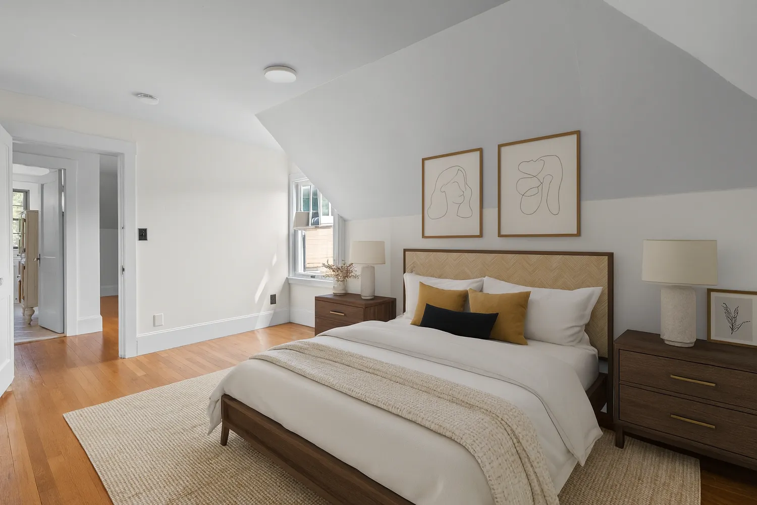 a bedroom with a bed and a night stand