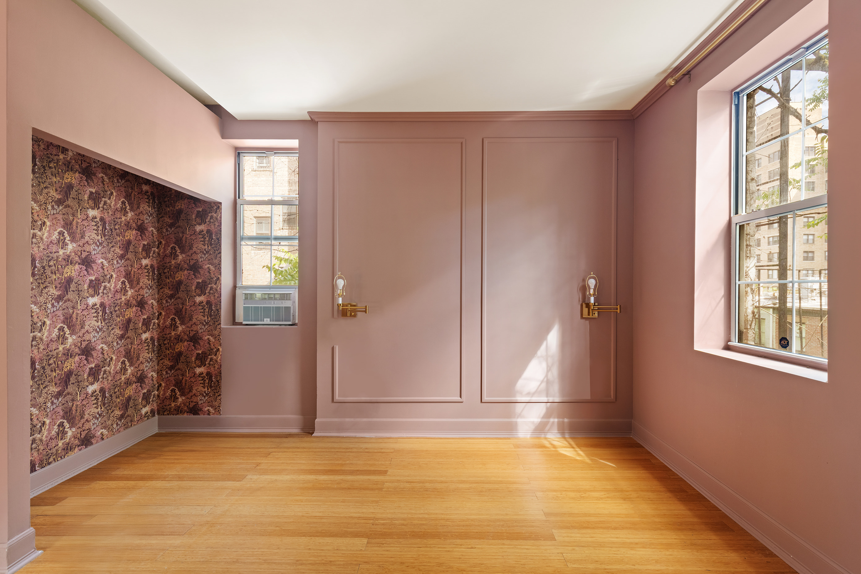 126 East 19th Street Manhattan, NY 10003 - Photo 6 of 13 an empty room with windows and closet