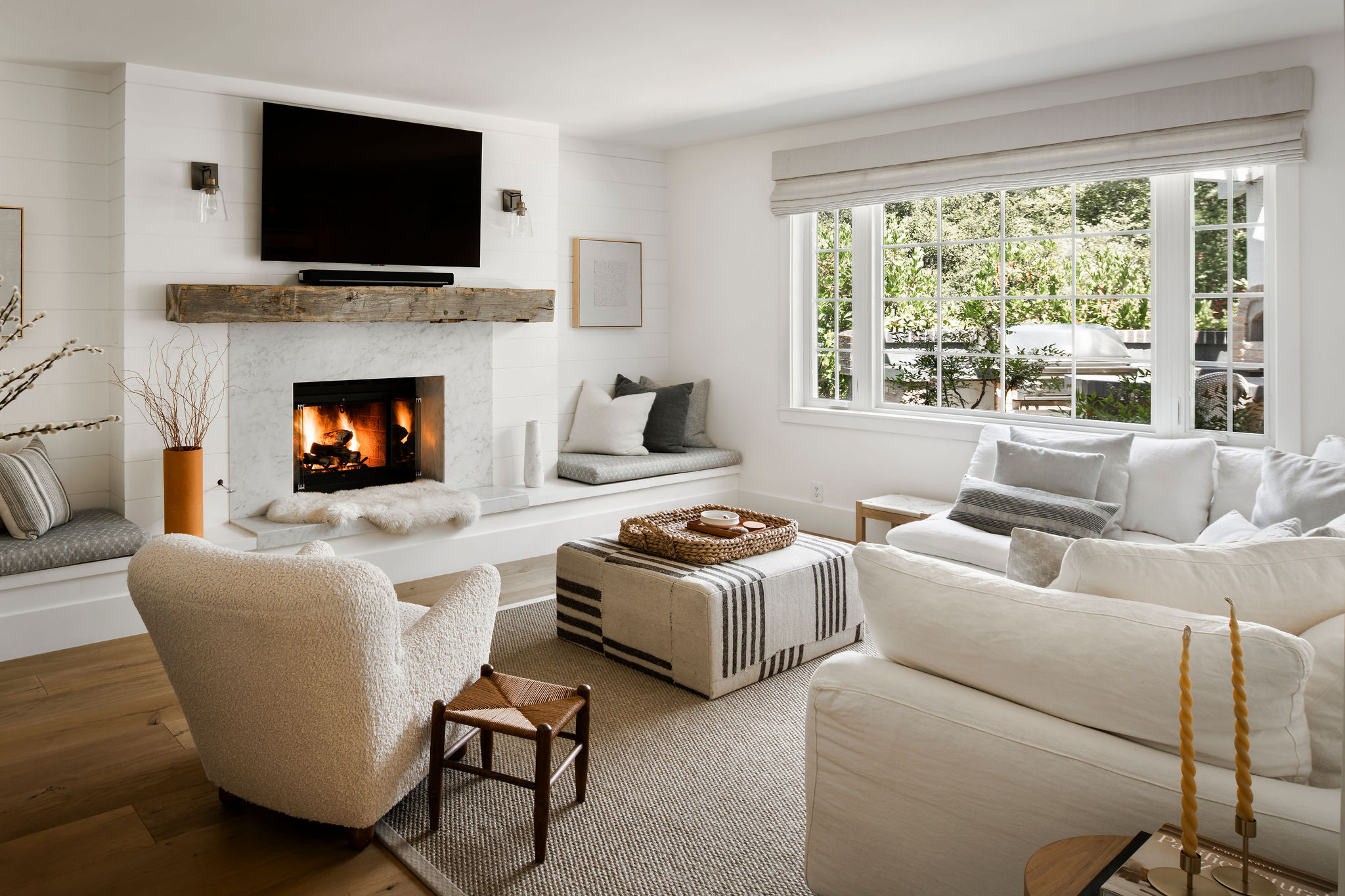 560 Cold Canyon Road Calabasas, CA 91302 - Photo 21 of 84 a living room with furniture a flat screen tv and a fireplace