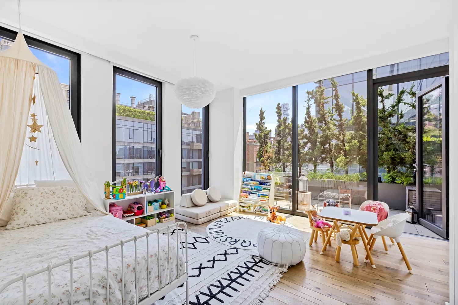 a bedroom with a bed and large windows