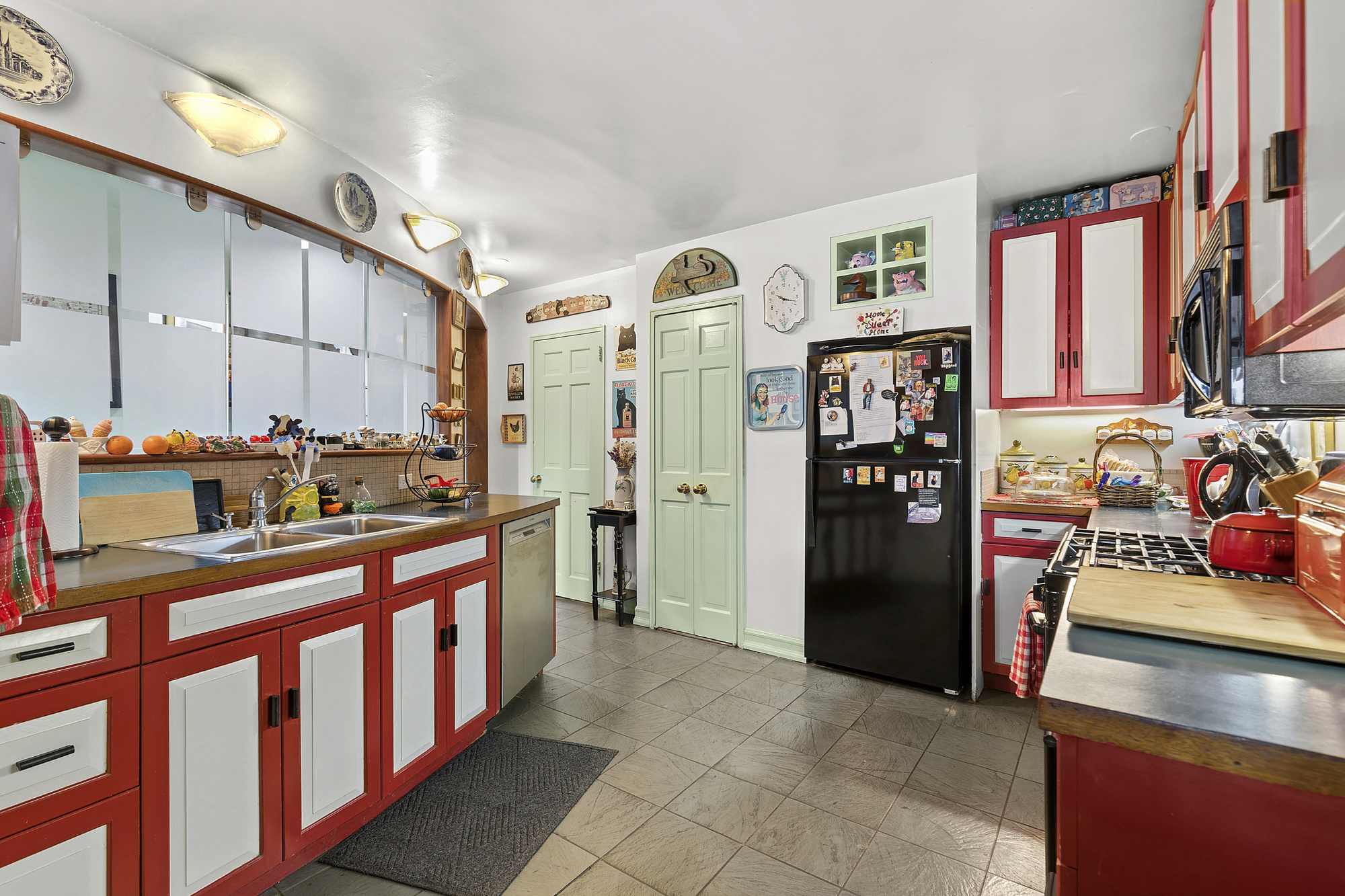 101 West 12th Street, Unit 15JK Manhattan, NY 10011 - Photo 9 of 22 a kitchen with stainless steel appliances granite countertop a refrigerator and a stove top oven