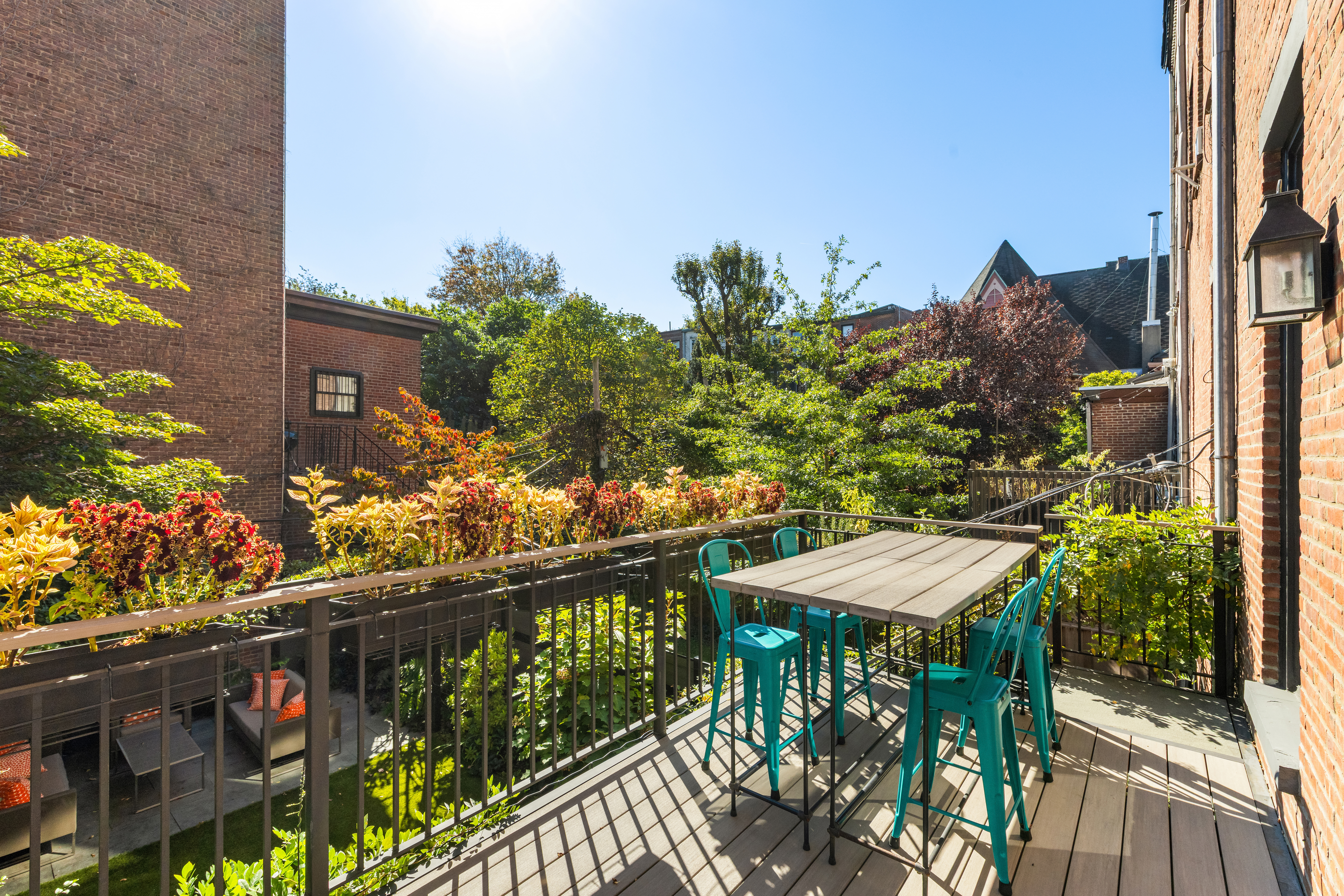 159 6th Avenue, Unit TRIPLEX Brooklyn, NY 11217 - Photo 16 of 19 a balcony with table and chairs and potted plants