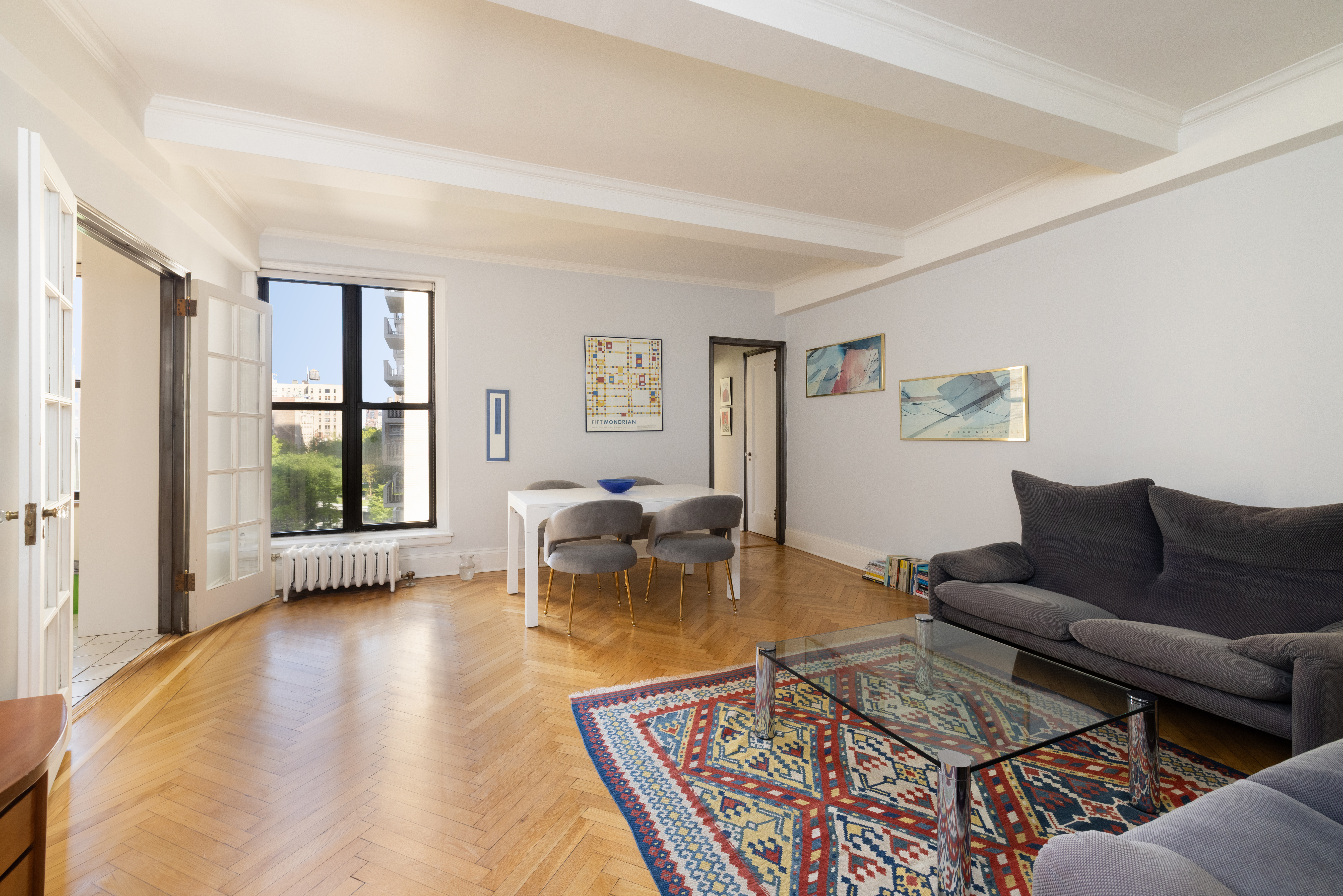 124 West 93rd Street, Unit 6E Manhattan, NY 10025 - Photo 2 of 9 a living room with furniture and a large window