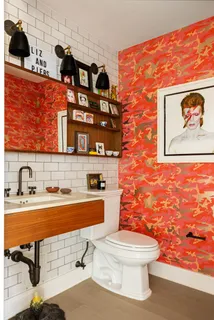 a picture of a living room with furniture and white wall