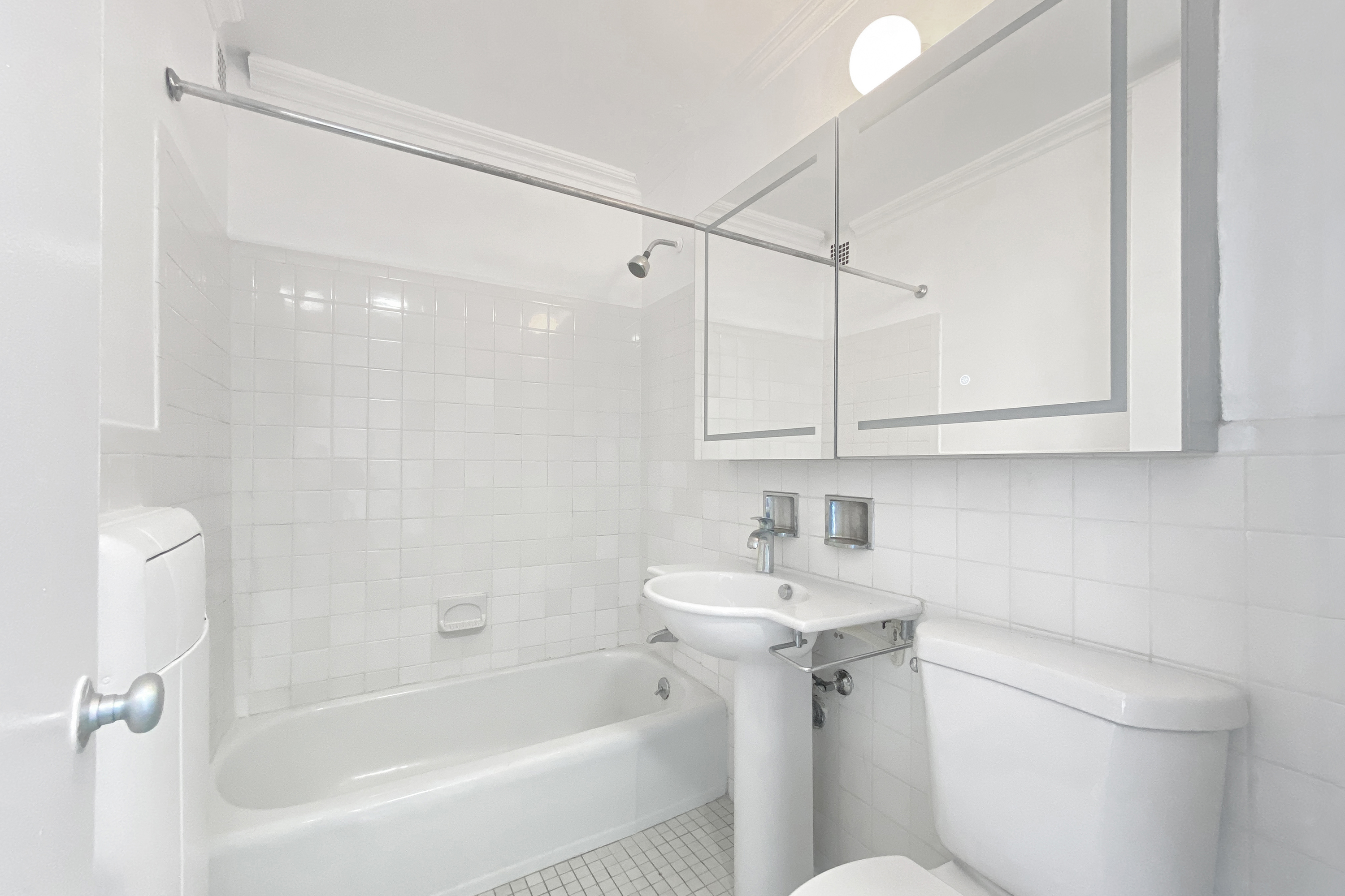 343 East 30th Street, Unit 19K Manhattan, NY 10016 - Photo 10 of 22 a bathroom with a sink toilet and shower