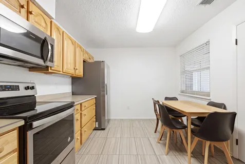 a spacious bedroom with a bed and a couch