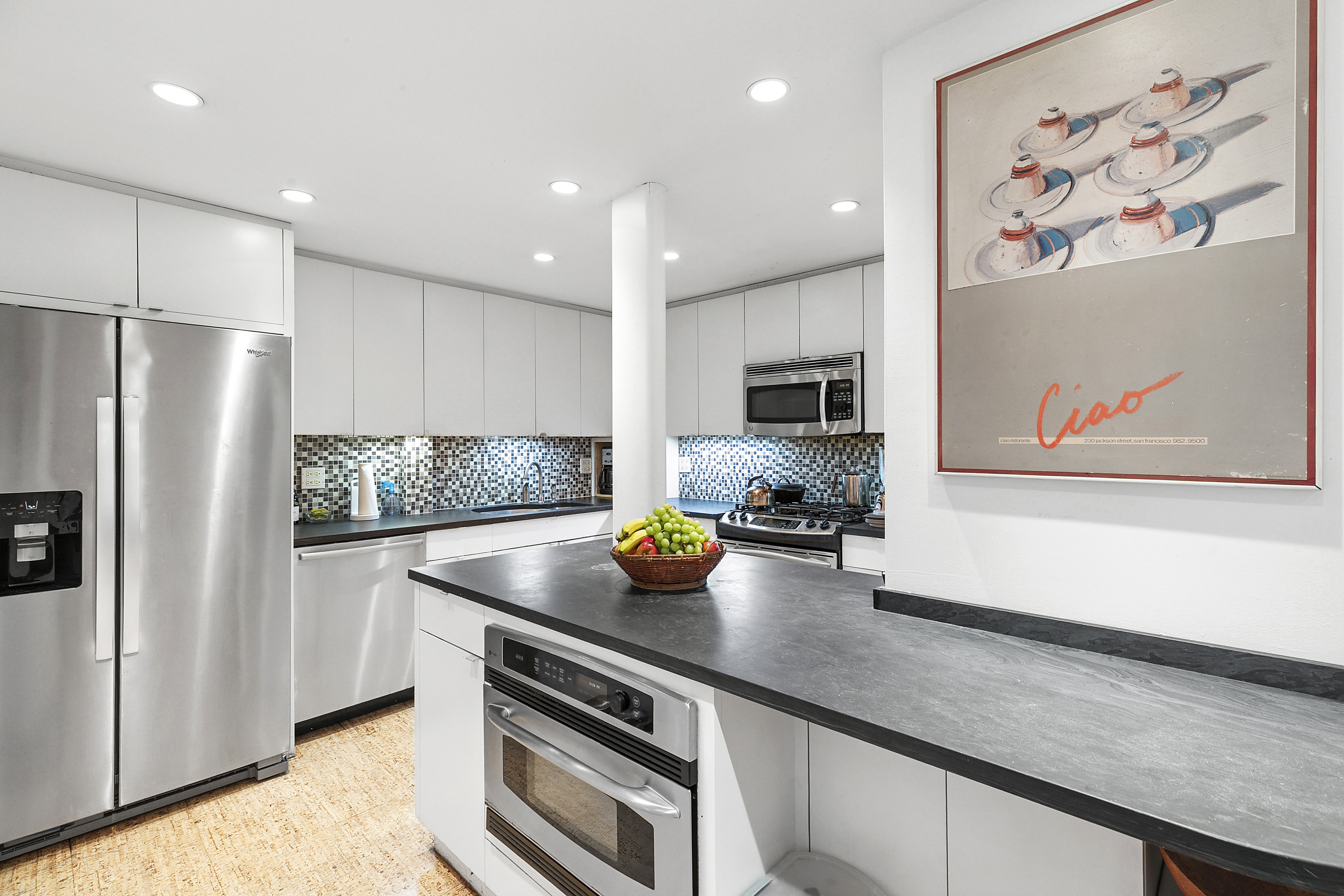 301 East 22nd Street, Unit 3PR Manhattan, NY 10010 - Photo 2 of 11 a kitchen with stainless steel appliances a stove a sink and a refrigerator