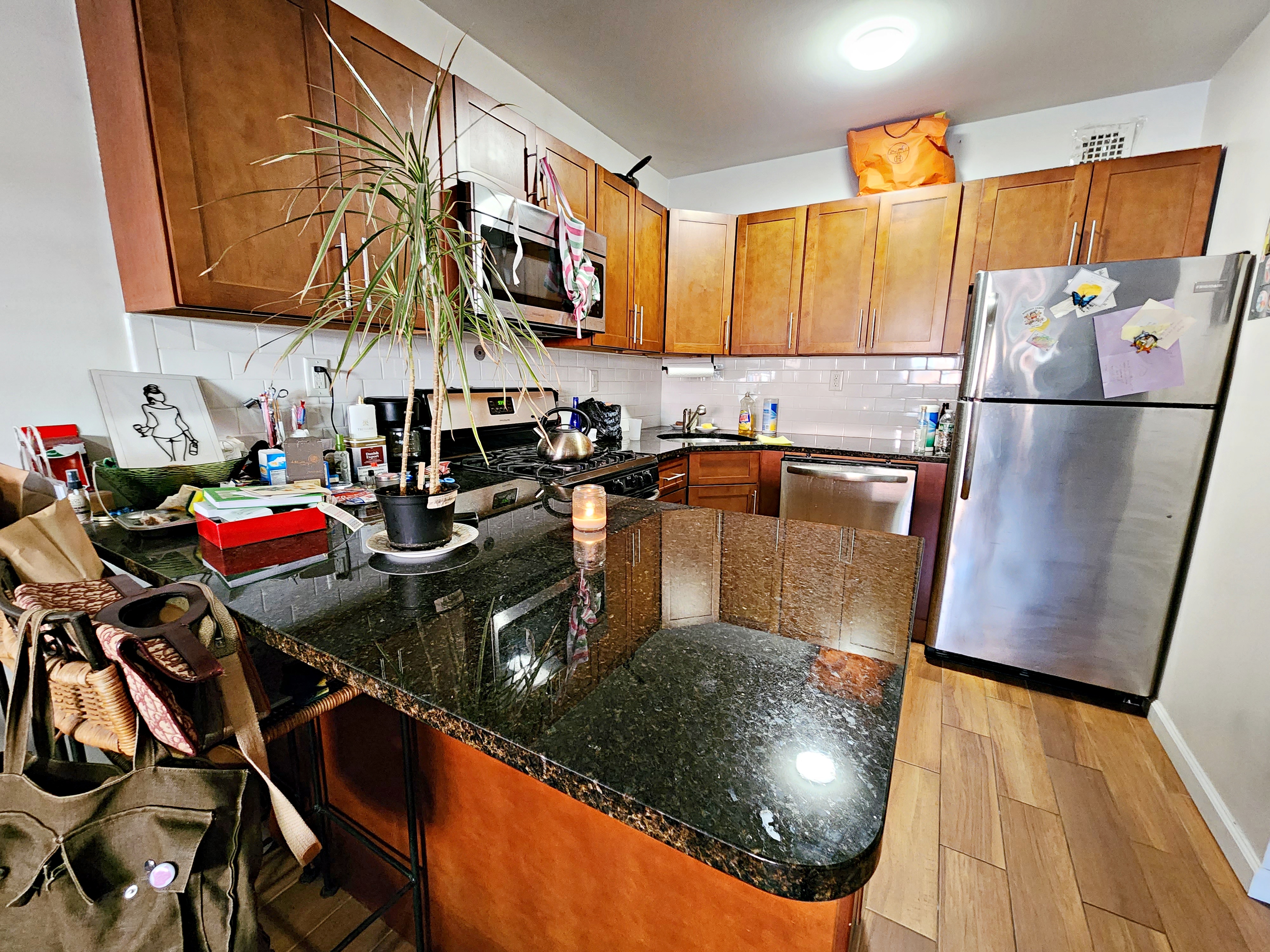 142 Frost Street, Unit 3F Brooklyn, NY 11211 - Photo 5 of 6 a kitchen with a sink a stove and a cabinets