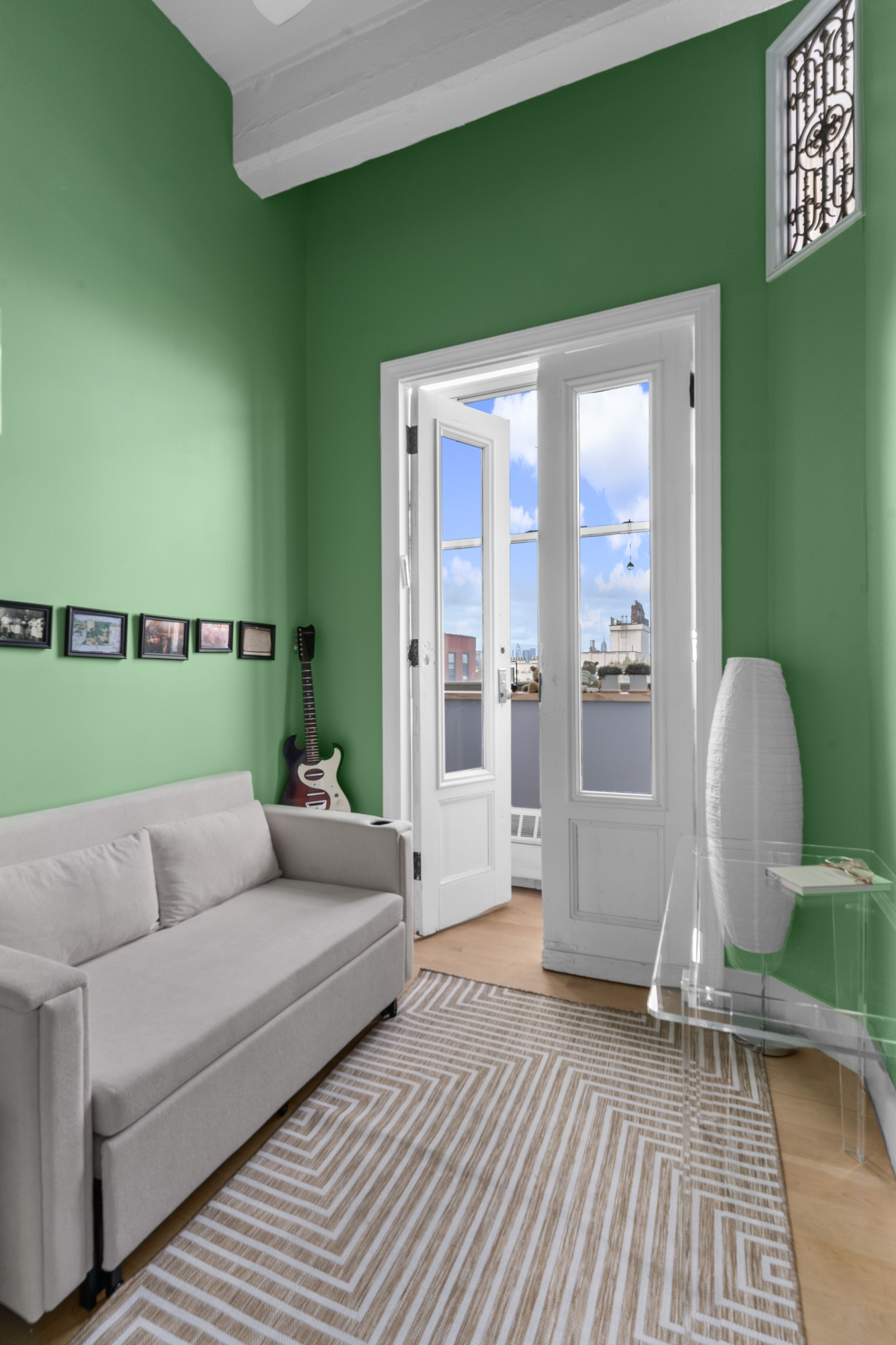 970 Kent Avenue, Unit 513 Brooklyn, NY 11205 - Photo 5 of 8 a living room with furniture and a large window