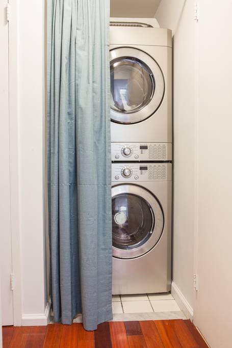 153 Stanton Street, Unit A1 Manhattan, NY 10002 - Photo 16 of 16 a utility room with dryer and washer