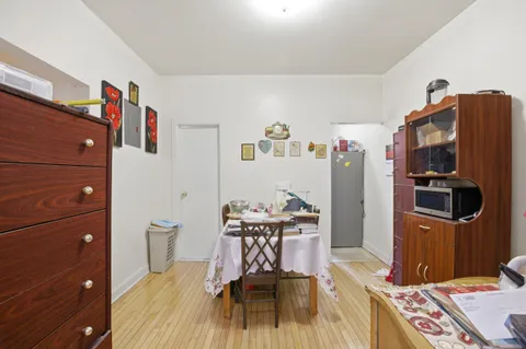 a view of a workspace with furniture and a flat screen tv