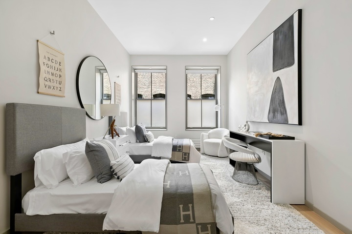 29 West 21st Street, Unit PH Manhattan, NY 10010 - Photo 13 of 17 a living room with furniture a large window and a potted plant
