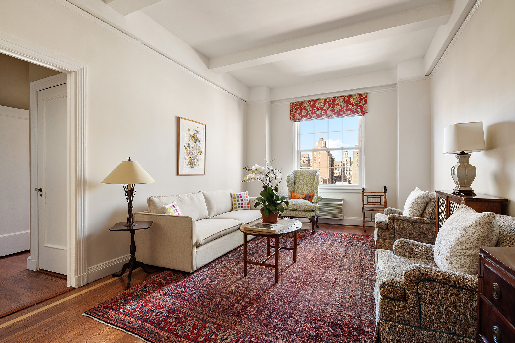 a living room with furniture and a rug