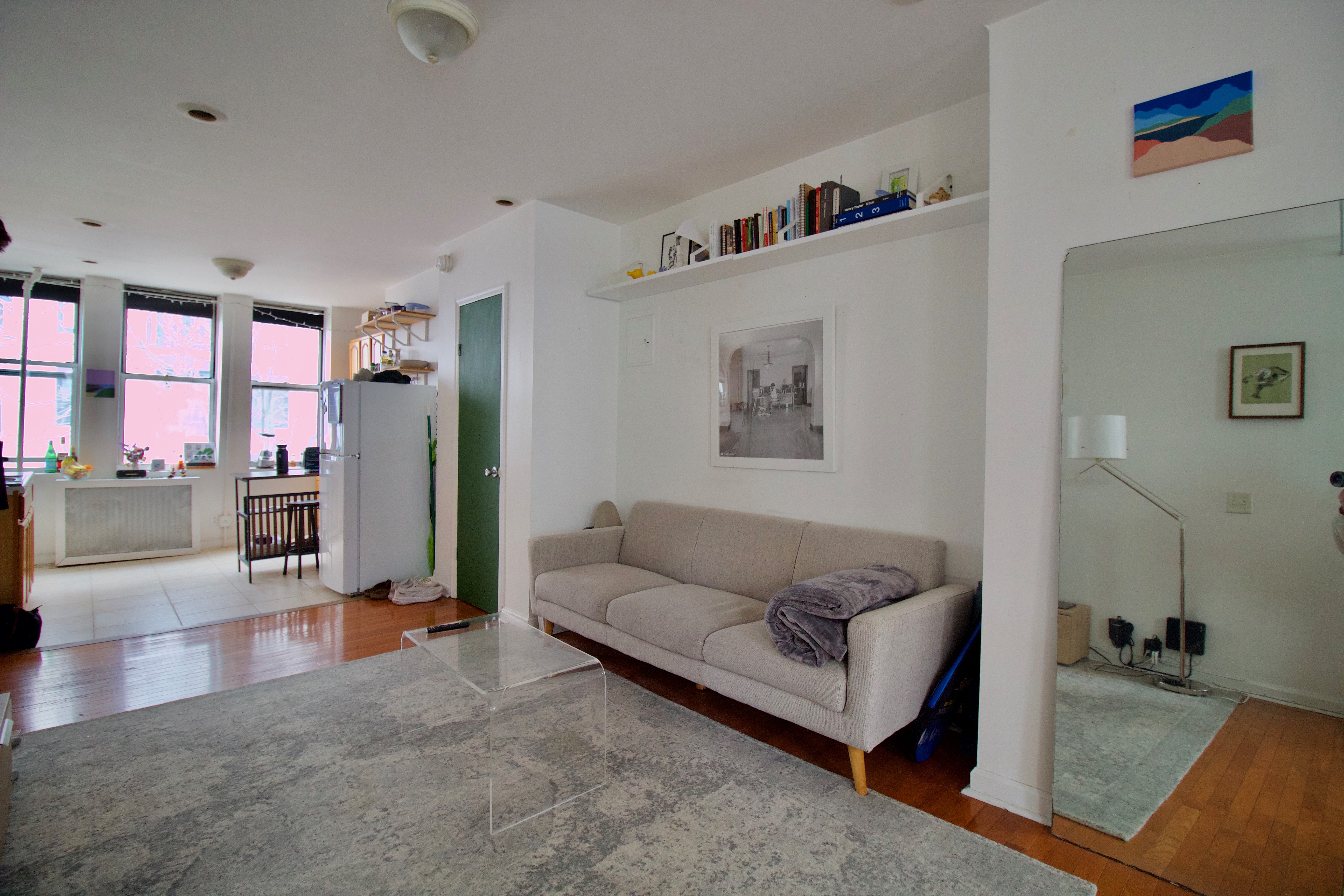 a living room with furniture and large window