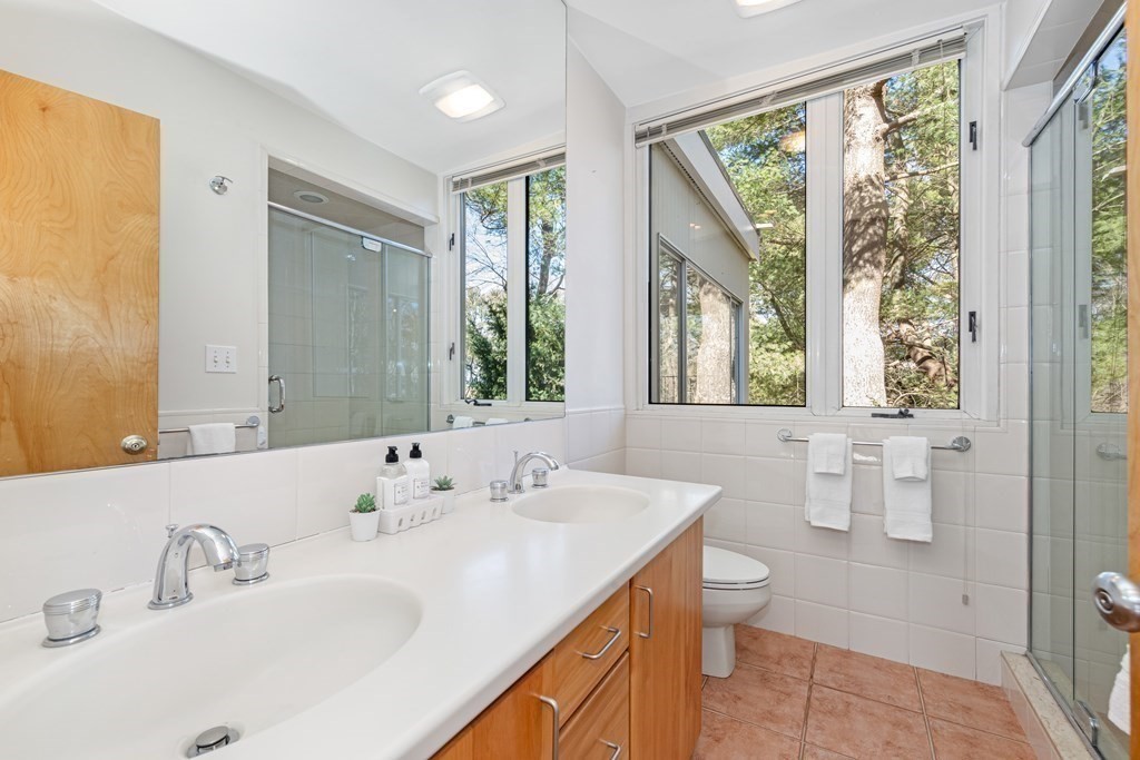 5 Field Road Lexington, MA 02421 - Photo 8 of 17 a bathroom with a double vanity sink toilet and a mirror