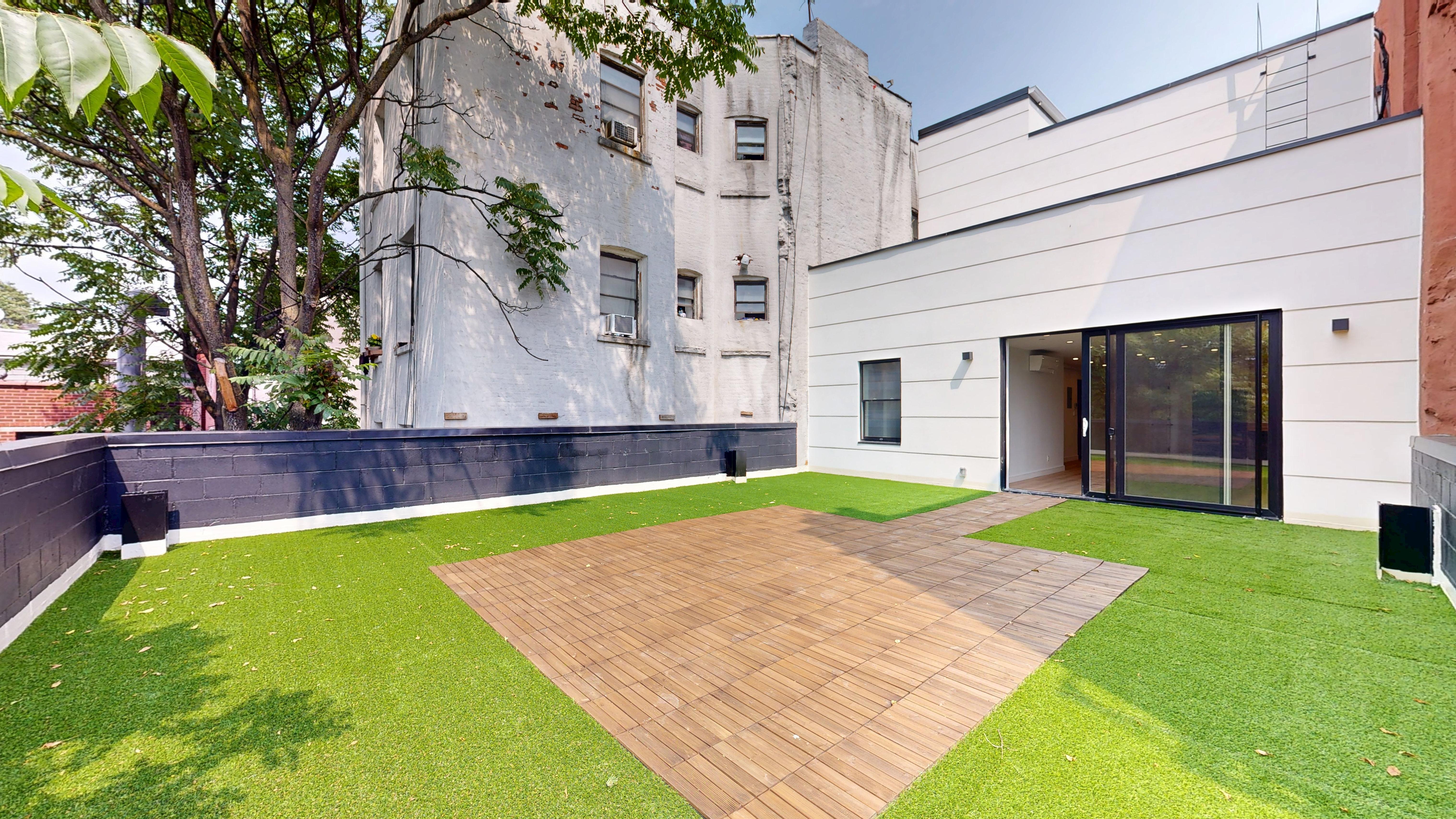 5614 3rd Avenue, Unit 2 Brooklyn, NY 11220 - Photo 8 of 12 a view of outdoor space yard and patio