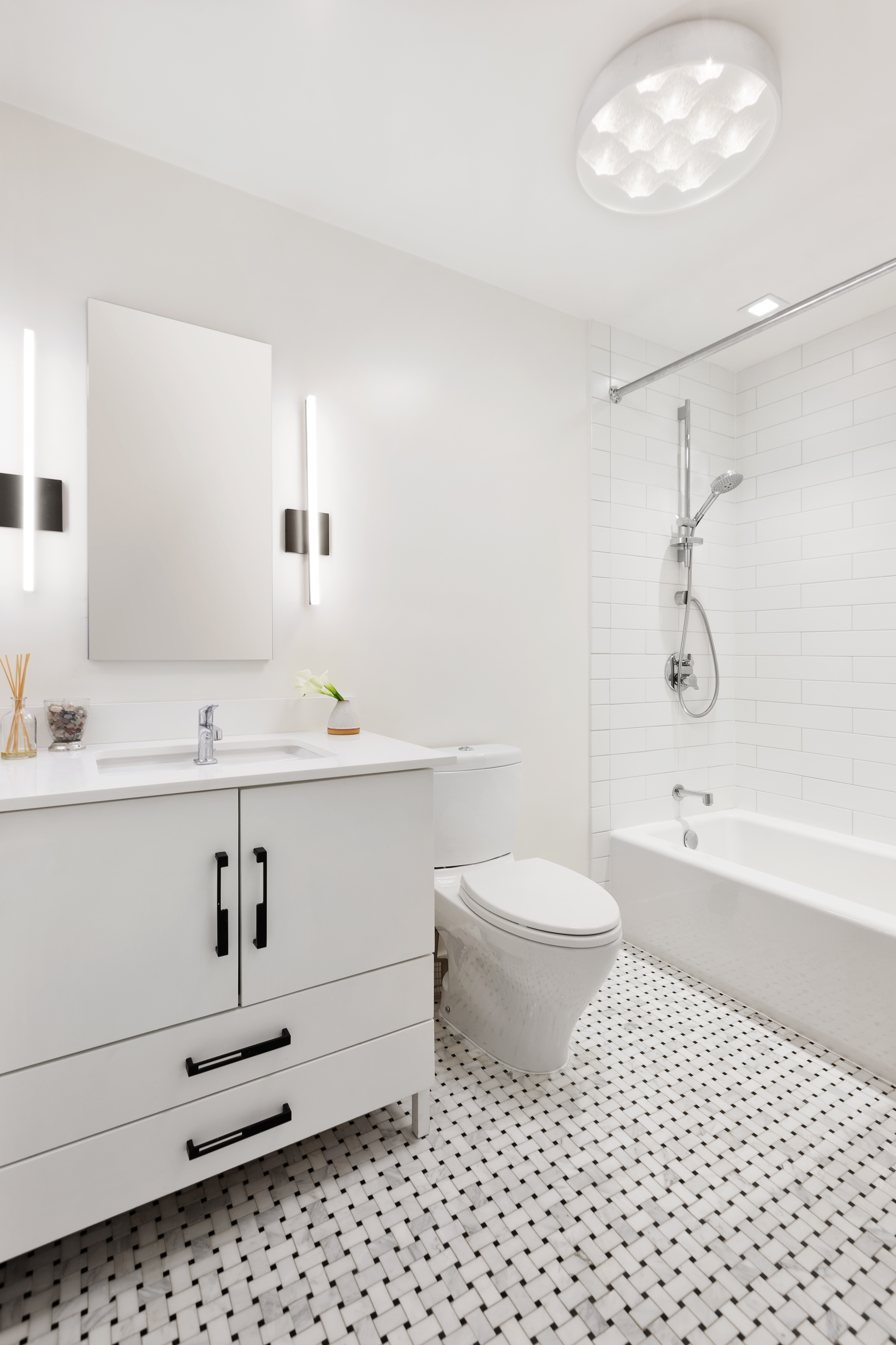 687 Greenwich Street, Unit TH7 Manhattan, NY 10014 - Photo 16 of 23 a bathroom with a sink a toilet and shower