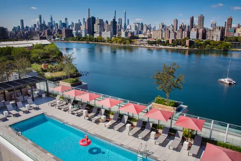 a view of a lake with couches and city view