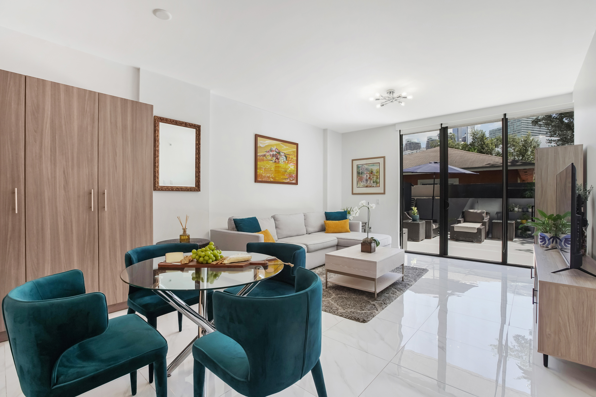 201 Southwest 17th Road, Unit 311 Miami, FL 33129 - Photo 2 of 21 a living room with furniture and a potted plant