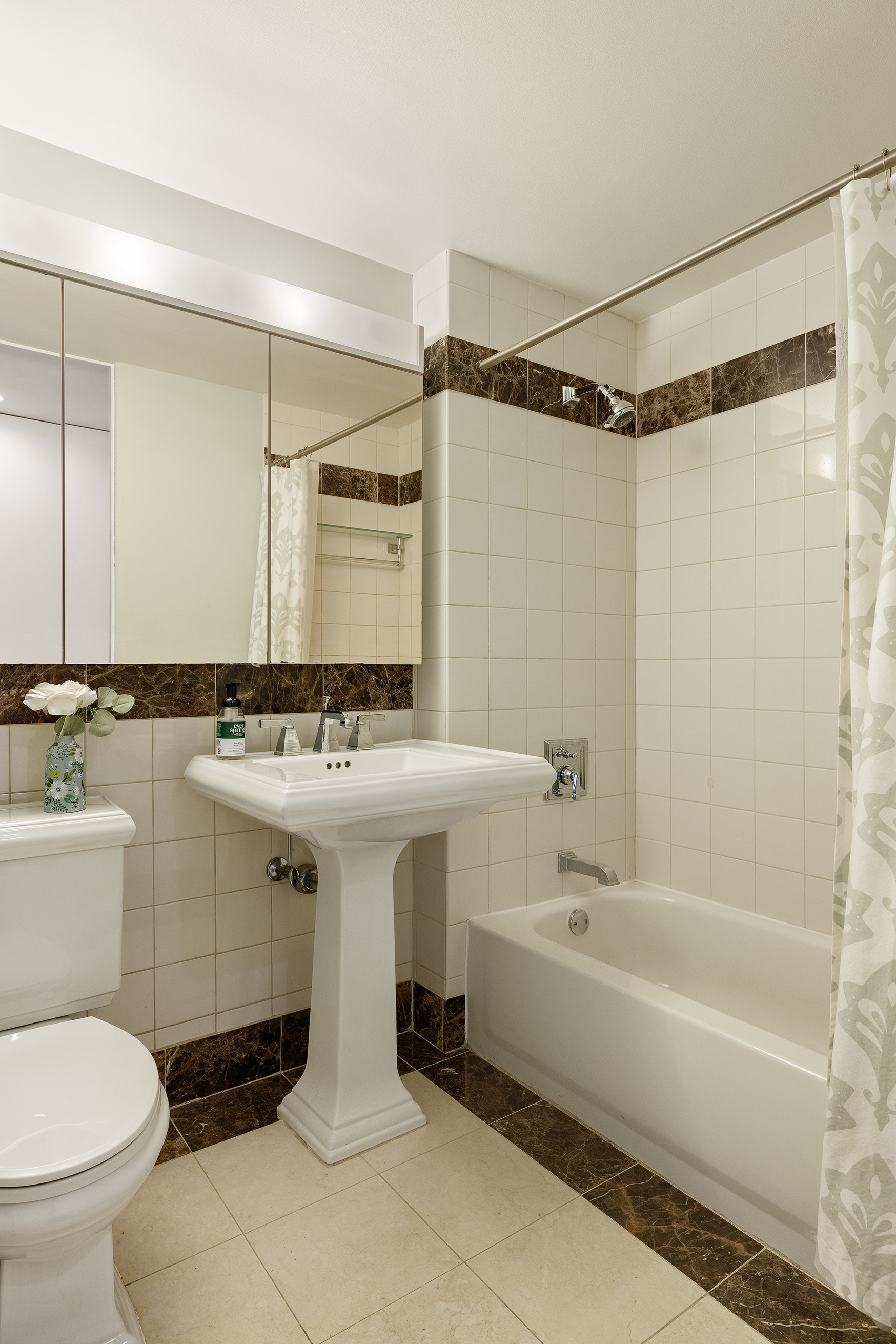 455 Main Street, Unit 4GH Manhattan, NY 10044 - Photo 5 of 9 a bathroom with a sink toilet and shower