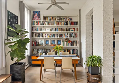 a shelf with books on a table and a book shelf