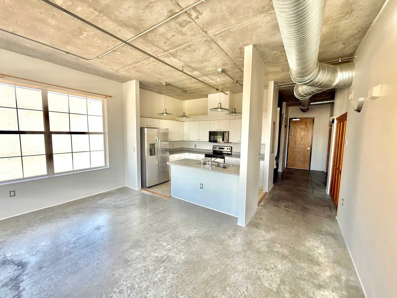 a view of empty room with ceiling fan