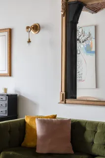 a living room with a couch and a window