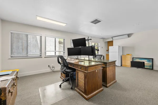 a room with furniture and a flat screen tv