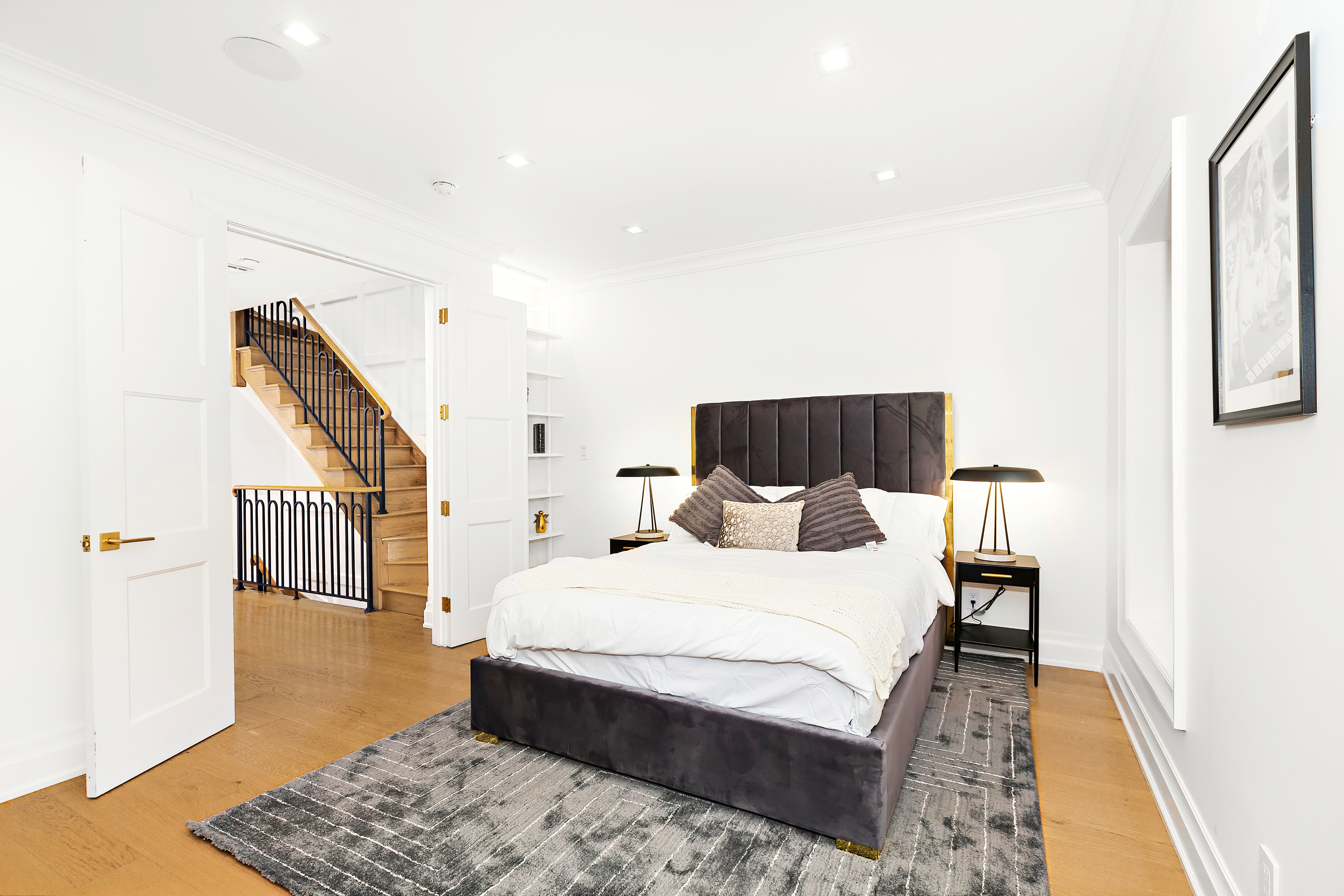 134 East 36th Street Manhattan, NY 10016 - Photo 22 of 28 a bedroom with a bed and a rug