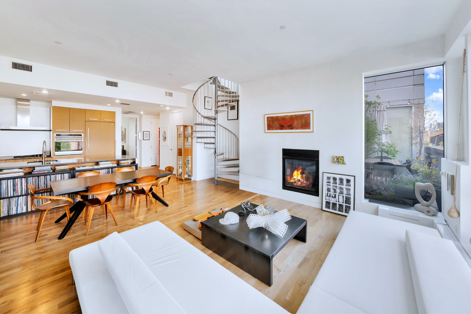 120 North 7th Street, Unit PH4B Brooklyn, NY 11249 - Photo 1 of 13 a living room with furniture fireplace and a flat screen tv
