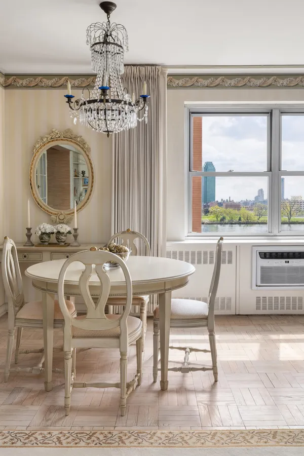 a view of a dining room with furniture window and outside view
