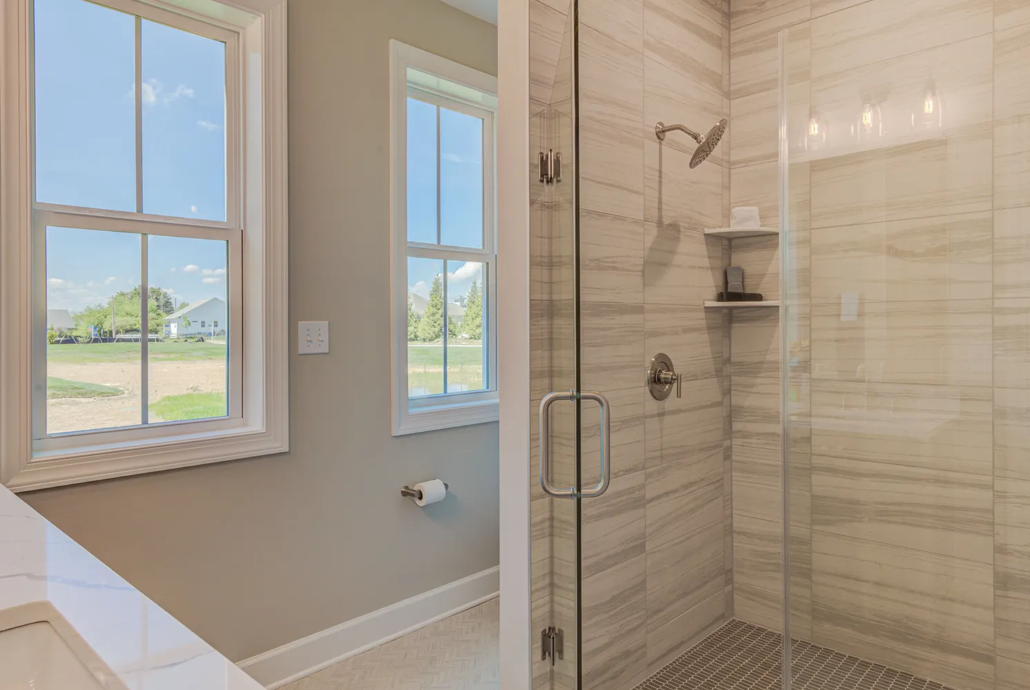 a bathroom with a bathtub and shower