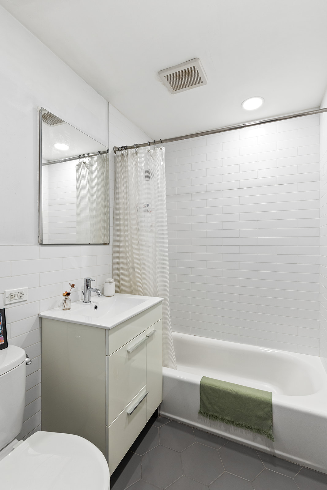 275 Webster Avenue, Unit 5I Brooklyn, NY 11230 - Photo 6 of 7 a bathroom with a sink a toilet and shower