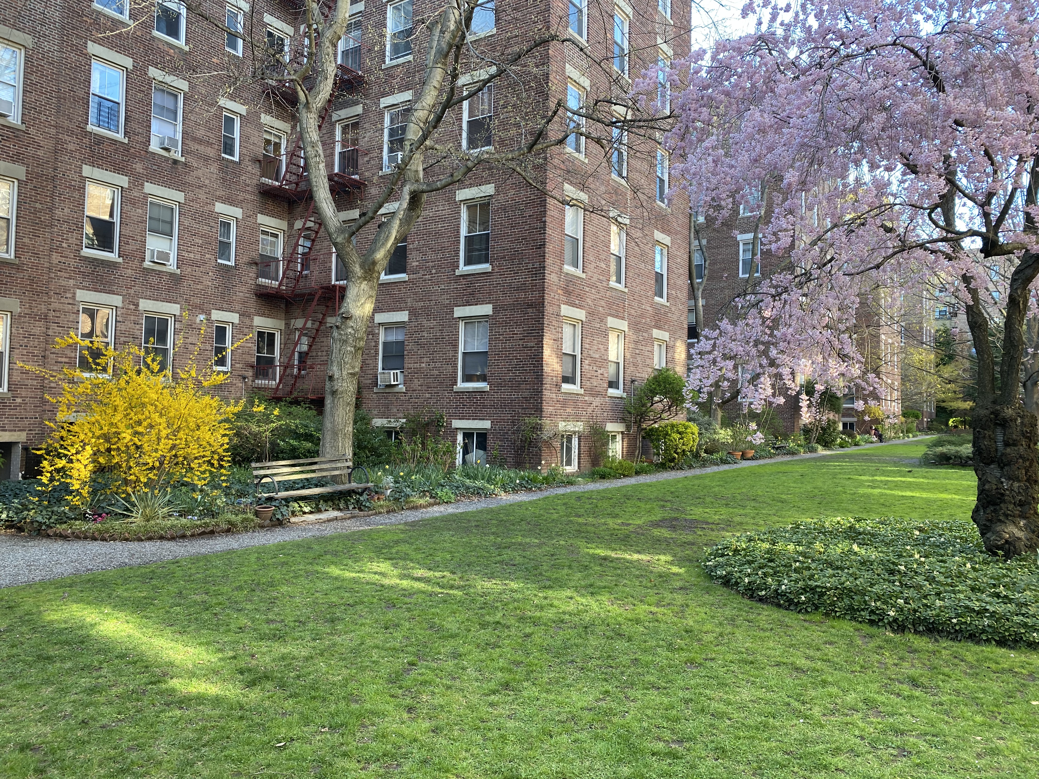 35-16 79th Street, Unit 1 Queens, NY 11372 - Photo 12 of 14 a view of a building with a yard