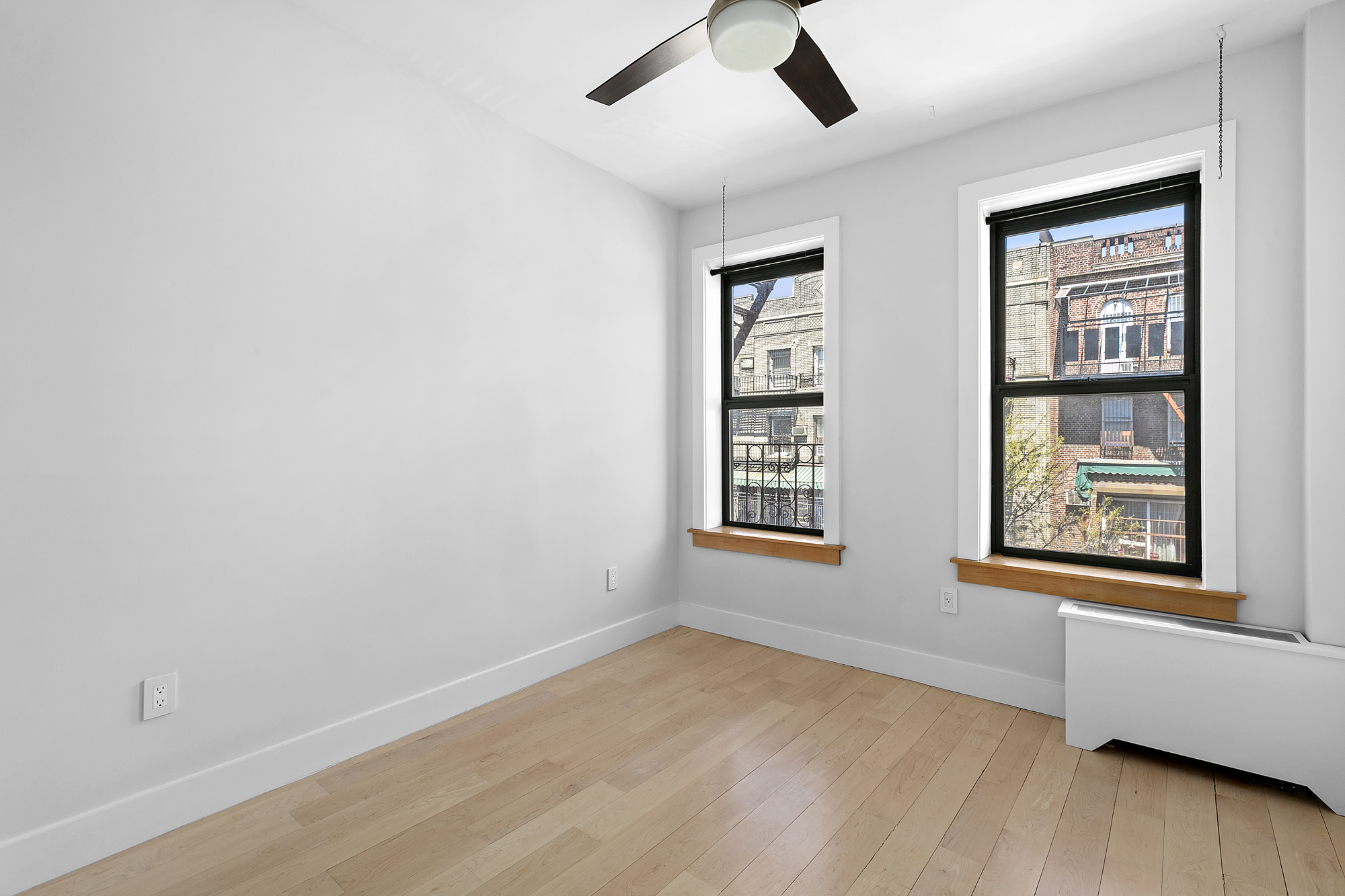 108 Division Avenue, Unit 22 Brooklyn, NY 11211 - Photo 8 of 11 an empty room with windows