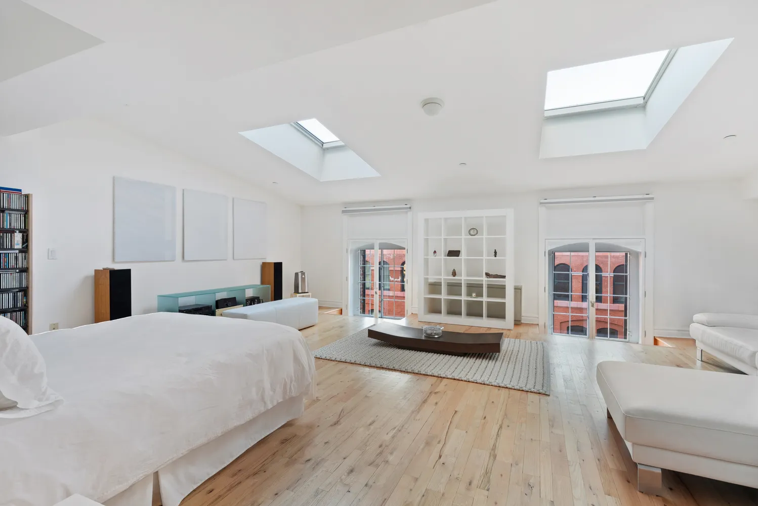 a bedroom with a large bed and a couch