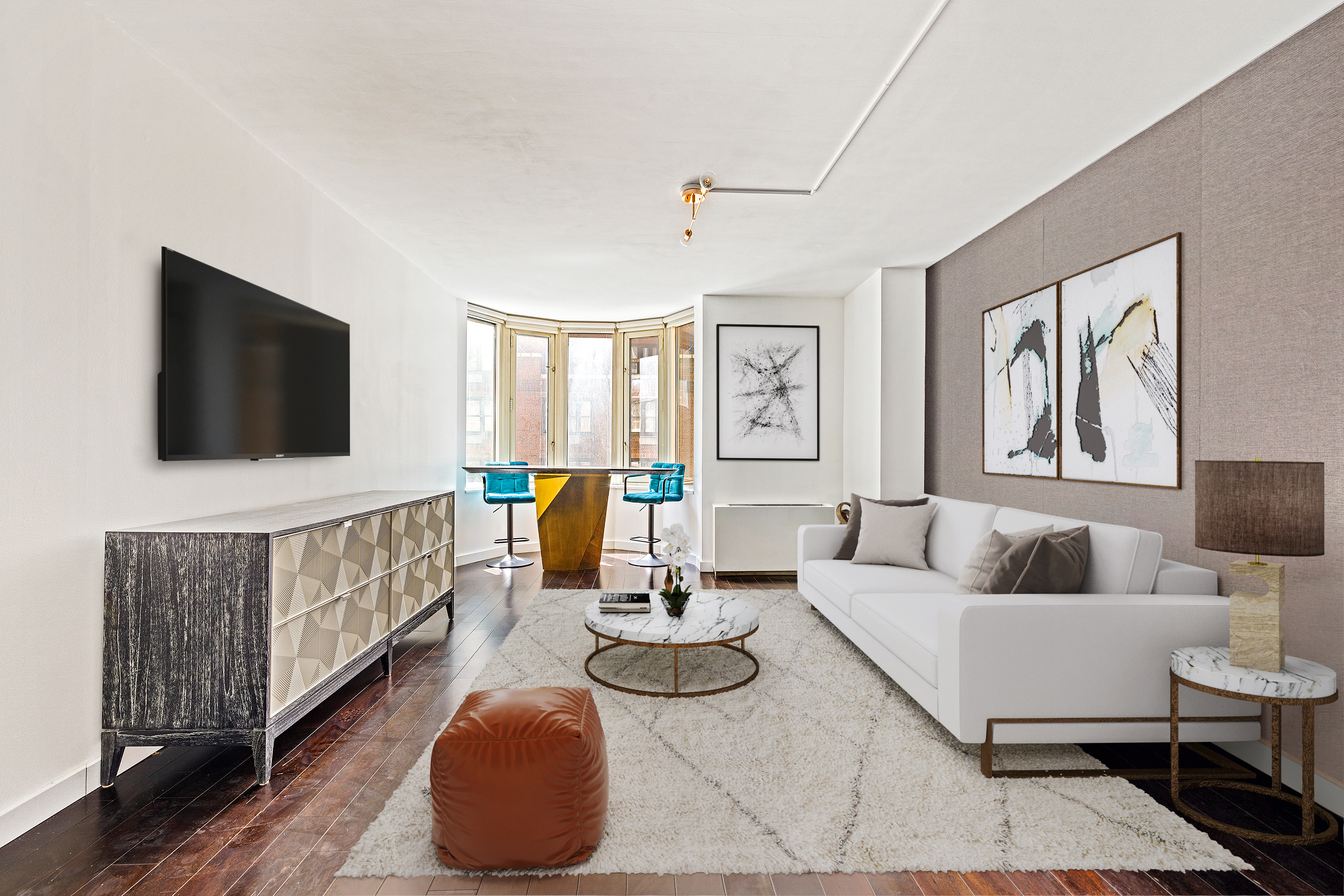 a living room with furniture and a flat screen tv